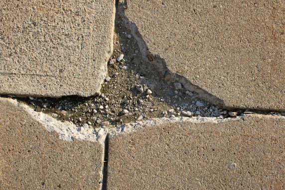 Cracked concrete floor before repair in Old Bridge NJ