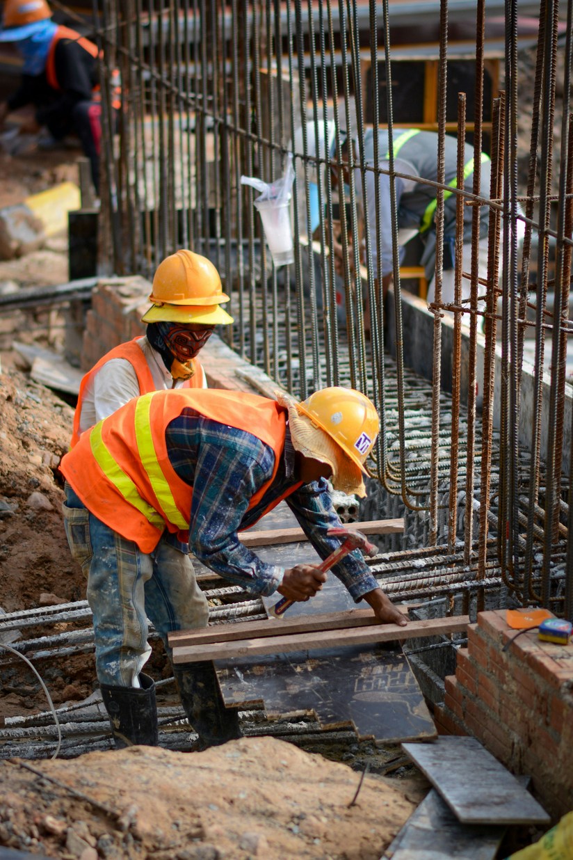 Construction crew working with a rebar cage on a job site in Old Bridge NJ